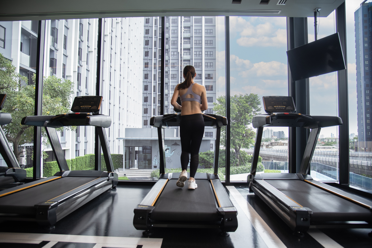 Hotel guest exercises on treadmill in gym | Maintenance