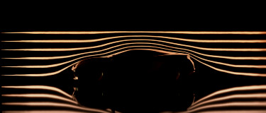 side view of a car with lines above it indicating the streamline