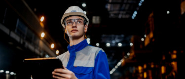 CMMS for Manufacturing user with tablet on factory floor