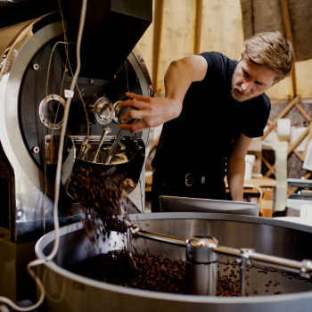 Coffee roasting technician operates machinery | Small Business