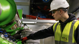 Energy worker attends to heavy industrial equipment asset | CMMS