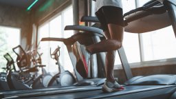 Runner works out on treadmill in hotel gym | CMMS