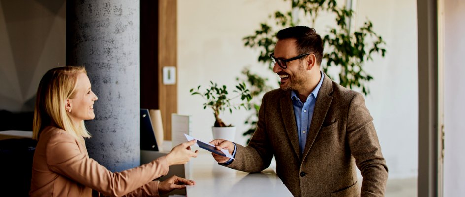 Hotel reception greets hotel guest | Maintenance Management