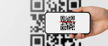 QR code on a mobile device scanning an inventory QR code | CMMS