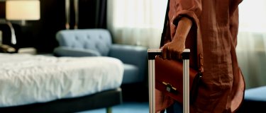 Guest arrives in hotel room with luggage | Hotel Maintenance