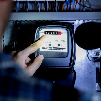 Technician takes a meter reading