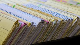 Close up view of paper-based maintenance records | CMMS