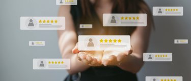 Women surrounded by maintenance software review cards | Maintainly