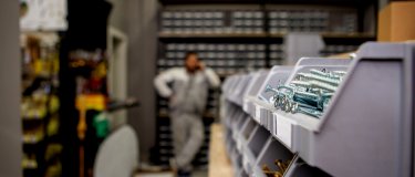 Spare parts sitting in containers in warehouse | Maintainly