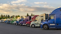 Fleet of trucks lined up in parking lot | Maintenance