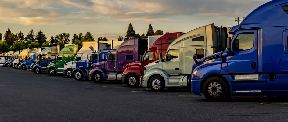 Fleet of trucks lined up in parking lot | Maintenance